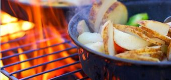 campfire cooking over flames